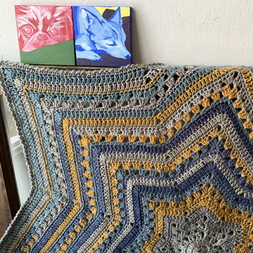 6-Day Star Blanket Photo with small paintings of dogs