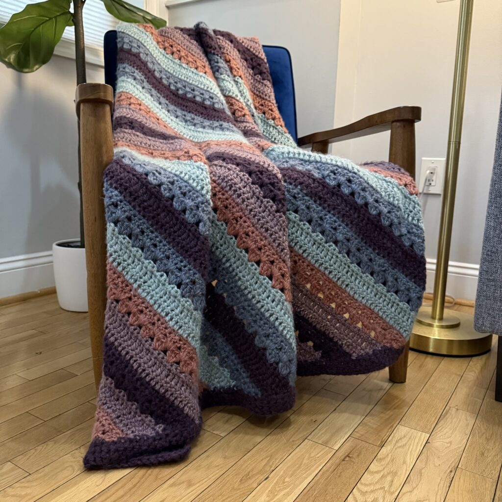 6-Day Corner to Corner Tranquility Blanket draped over a chair