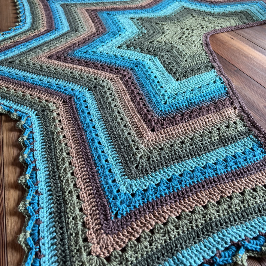 6-Day Star Shawl shown in Lion Brand Mandala Yarn in the color Dragon