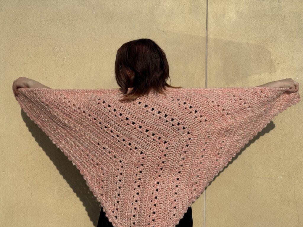 Decorative image pink triangular shawl being modeled