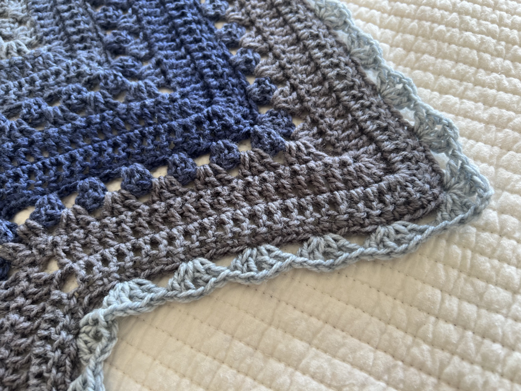 6-Day Superstar Shawl shown in Lion Brand Mandala Bonus Bundle Yarn