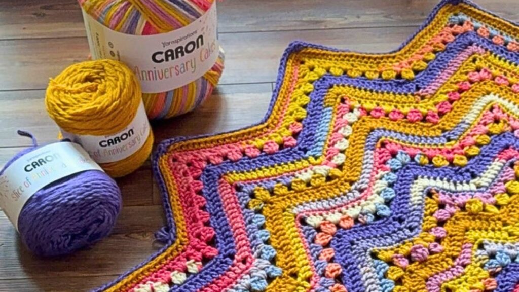 Brightly colored 6-Day Superstar Blanket with Caron Anniversary Cakes